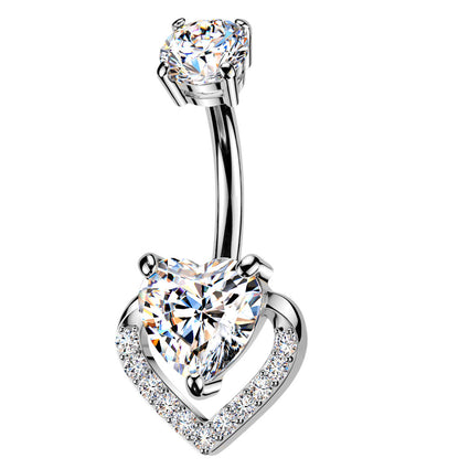 A silver-toned belly button ring featuring a curved barbell with a large heart-shaped clear gemstone at the bottom and a smaller round clear gemstone at the top, set against a plain white background.