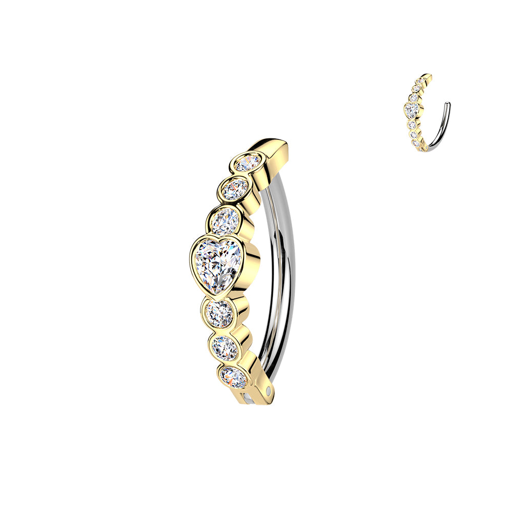Gold and silver hoop earrings with clear gemstones on a white background