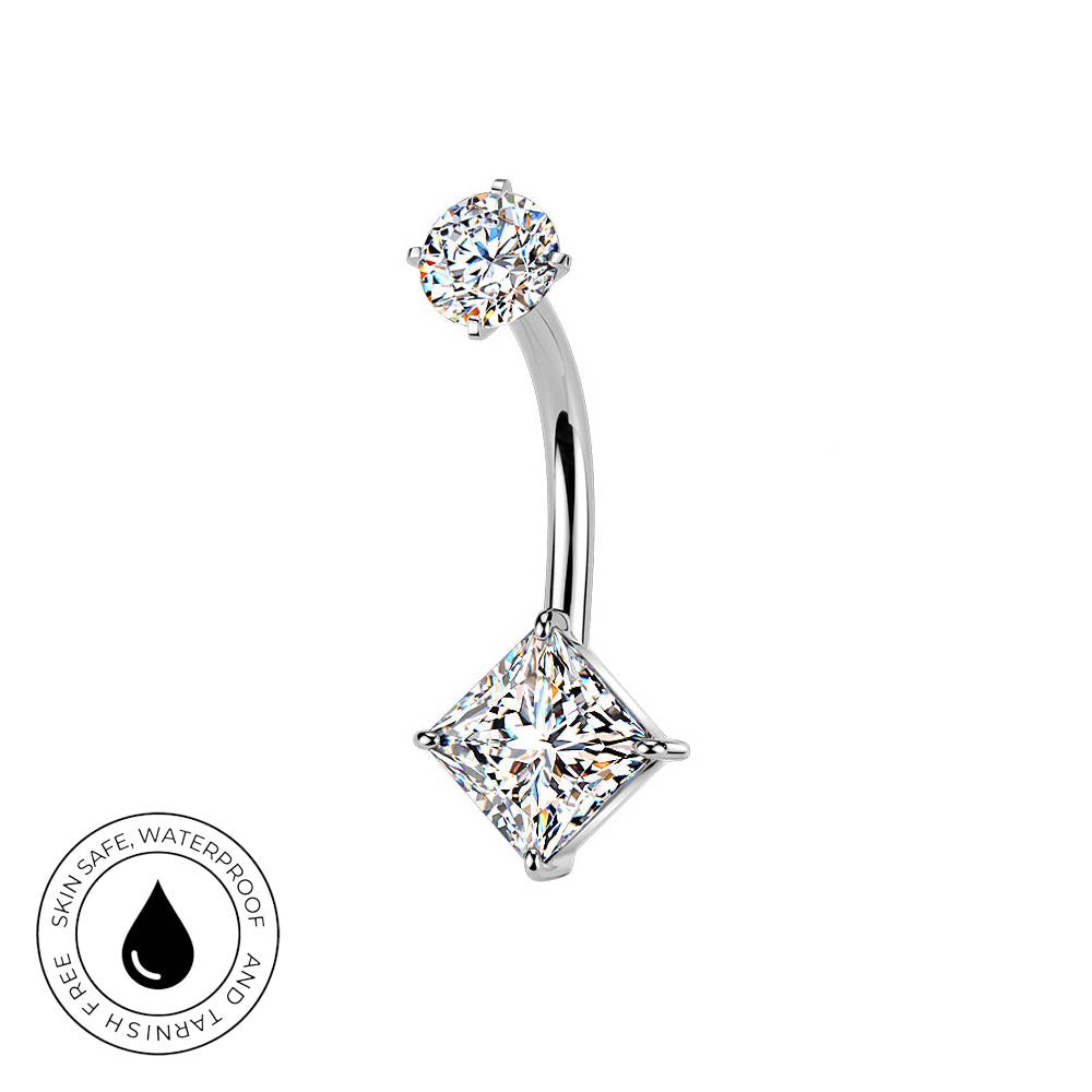 A curved barbell belly button ring with a top round-cut gemstone and a larger square princess-cut gemstone dangling below, shown on a white background with a small 'skin-safe waterproof' badge in the lower left.