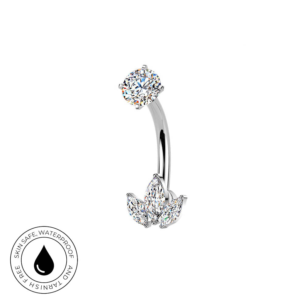 Silver curved barbell belly button ring with a round clear gemstone on top and a flower-shaped cluster of clear gemstones on the bottom, shown on a white background with a circular 'Skin Safe Waterproof' badge in the lower left.