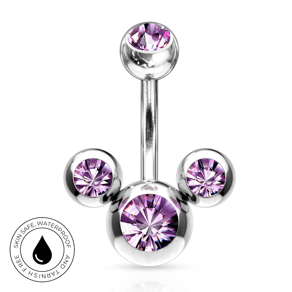 A silver-toned navel piercing barbell with three ball ends, each set with a faceted purple gemstone. A circular badge in the bottom-left corner highlights 'SkinSafe Waterproof' features.
