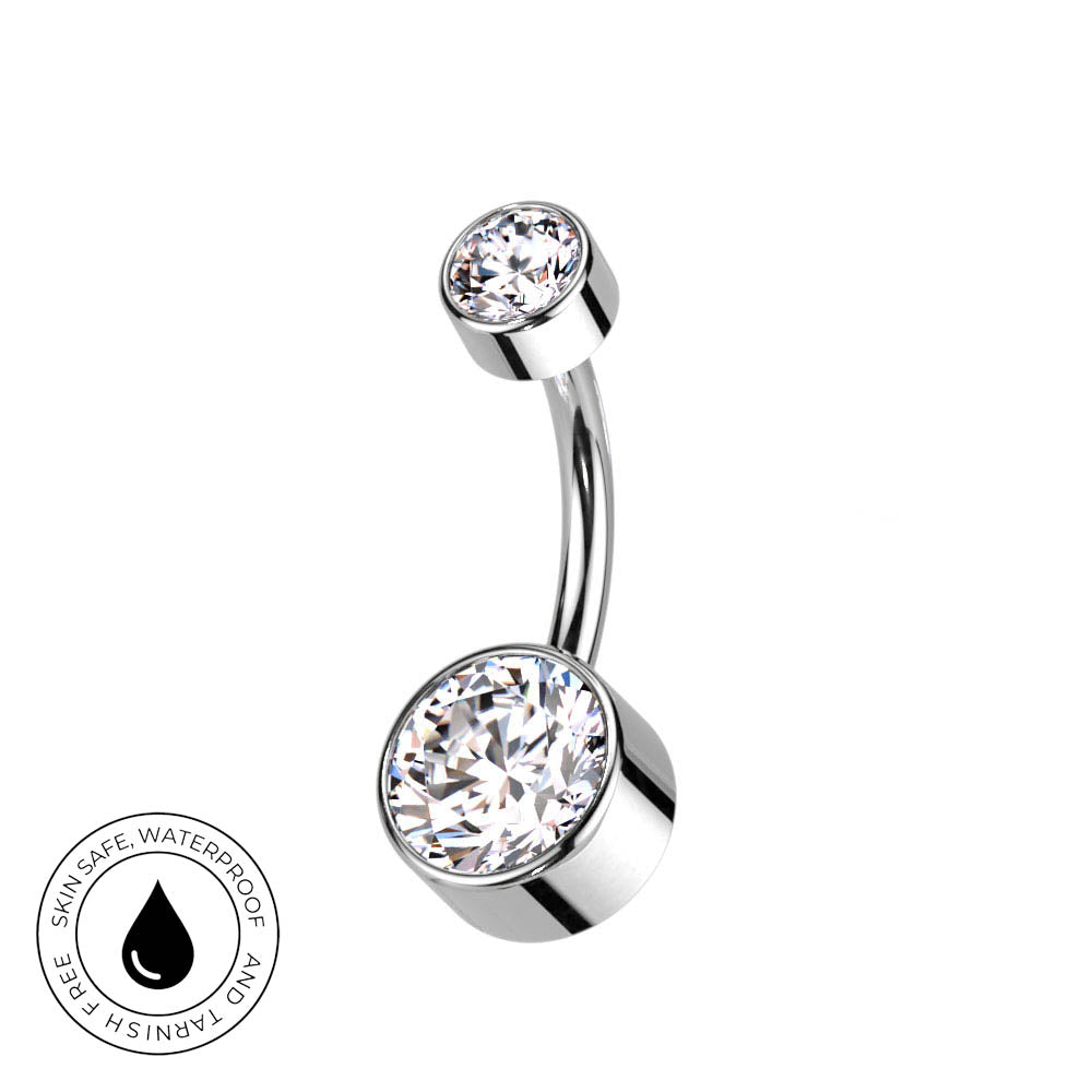 A curved barbell belly button ring with two clear faceted gemstones in polished silver-toned settings, shown on a white background with a circular 'Skin Safe Waterproof' badge in the lower-left corner.