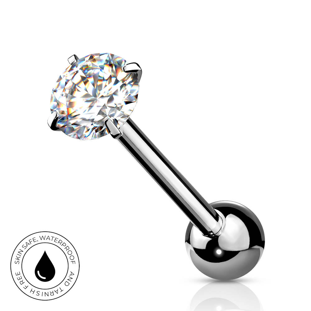 A silver-toned labret piercing barbell with a large, round-cut clear gemstone in a prong setting and a polished ball end, shown on a white background with a small circular 'SkinSafe Waterproof' badge in the lower left.
