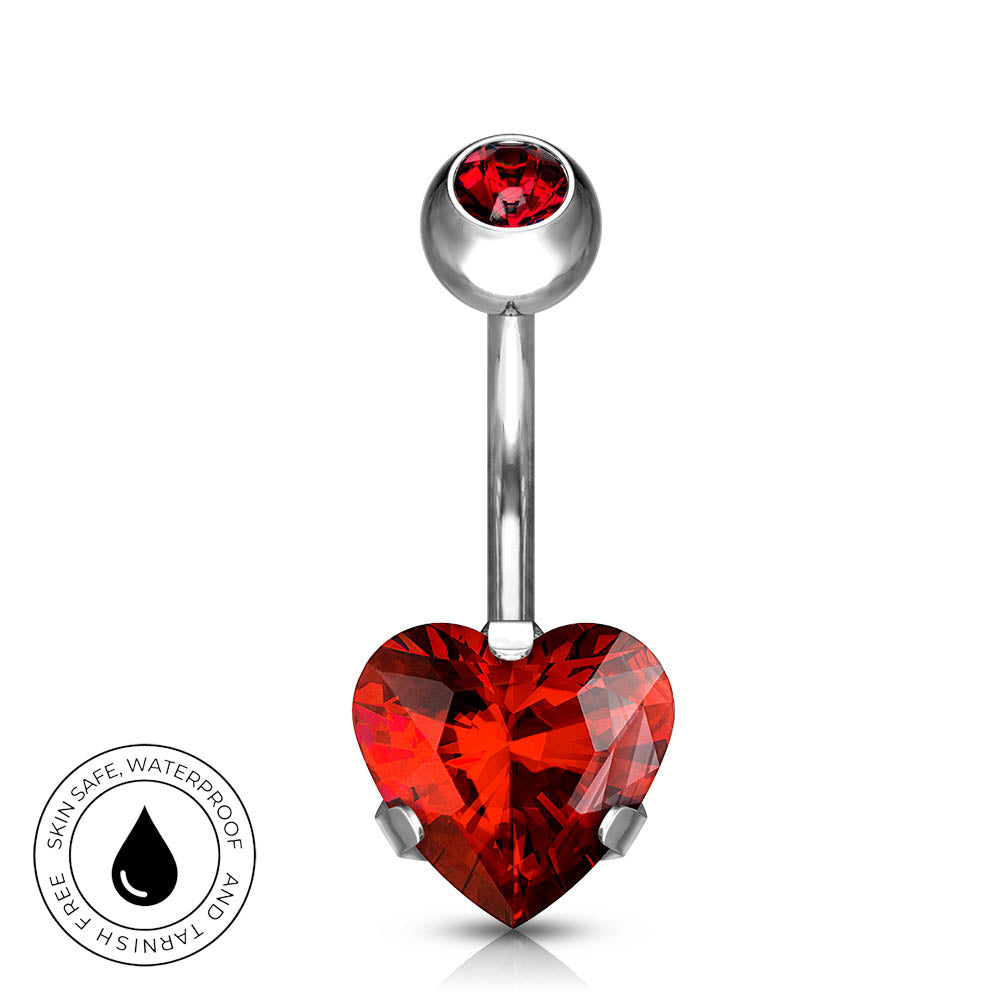 A silver-toned navel barbell piercing with a faceted red heart-shaped crystal and a smaller red crystal at the top, shown on a white background with a circular 'Skin Safe Waterproof' badge in the lower left.