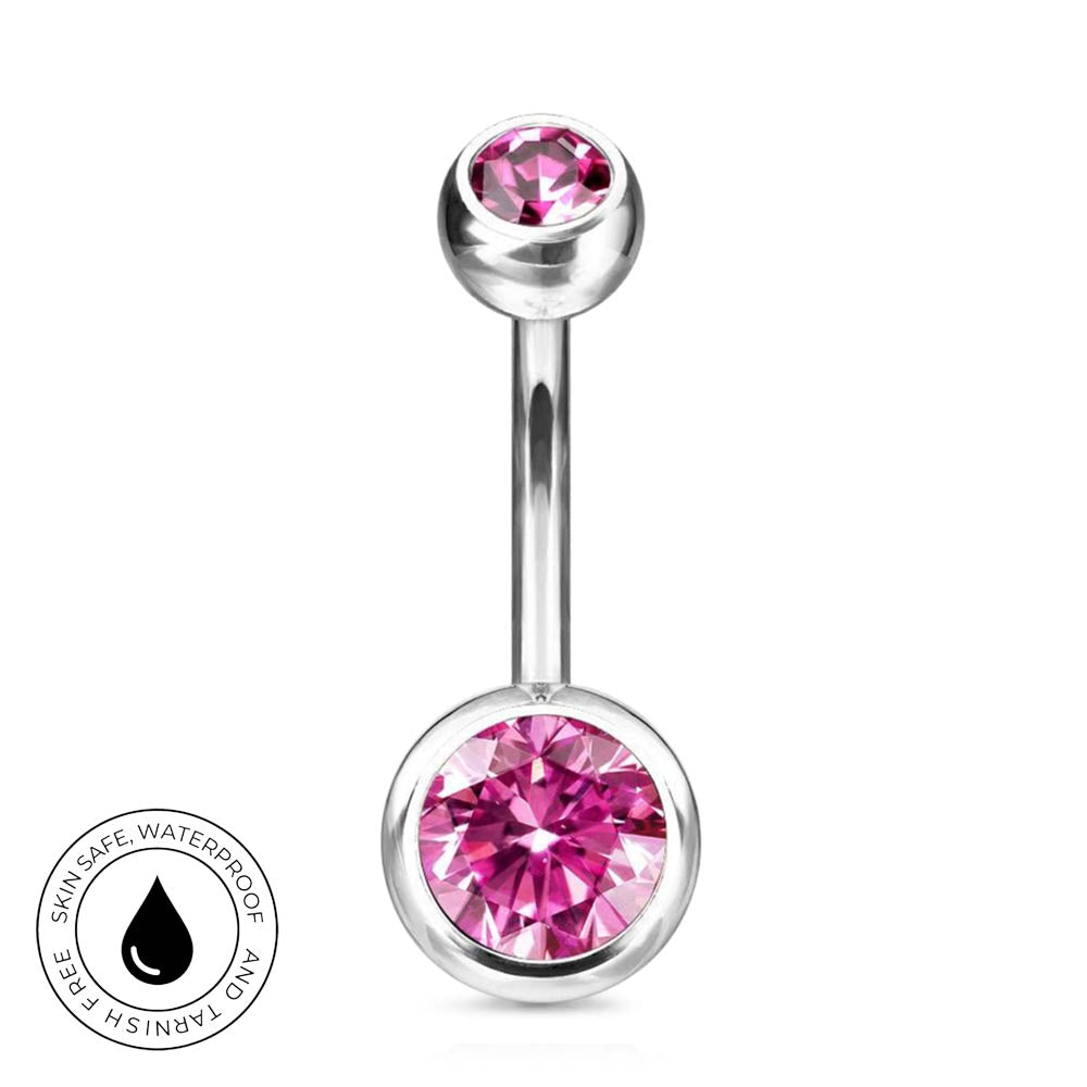 A silver-toned curved barbell belly button ring with a large faceted pink gemstone on the bottom and a smaller pink gemstone on the top, shown on a white background with a circular 'Skin Safe Waterproof' badge in the lower left.