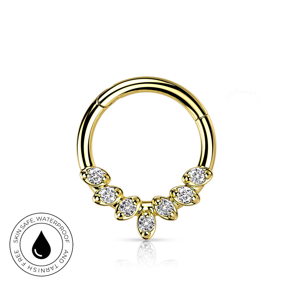Gold-plated curved hoop piercing ring decorated with five marquise-cut clear gemstones, shown on a white background with a circular 'Skin Safe Waterproof' badge in the lower-left corner.
