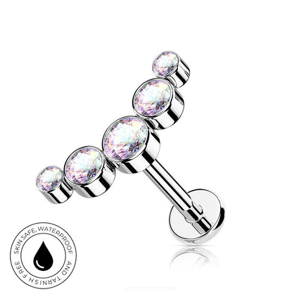 A silver-toned barbell piercing stud with four iridescent, faceted gemstones in different sizes, shown on a white background with a circular 'Skin Safe Waterproof' badge in the lower-left corner.