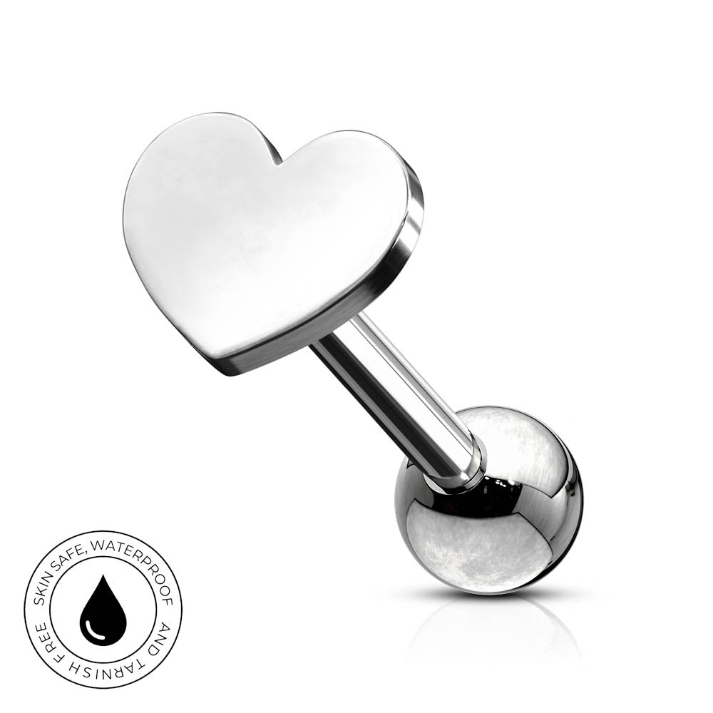 A silver stainless steel labret piercing barbell featuring a polished heart-shaped front and a spherical ball back, shown on a white background with a circular 'Skin Safe Waterproof' badge in the bottom-left corner.
