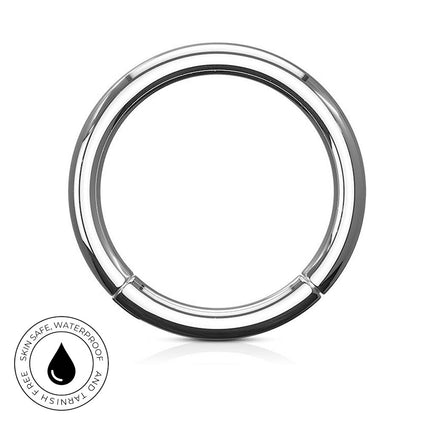 A polished stainless steel circular ring with a black inner lining, shown on a white background with a small circular 'SkinSafe Waterproof' badge in the lower-left corner.