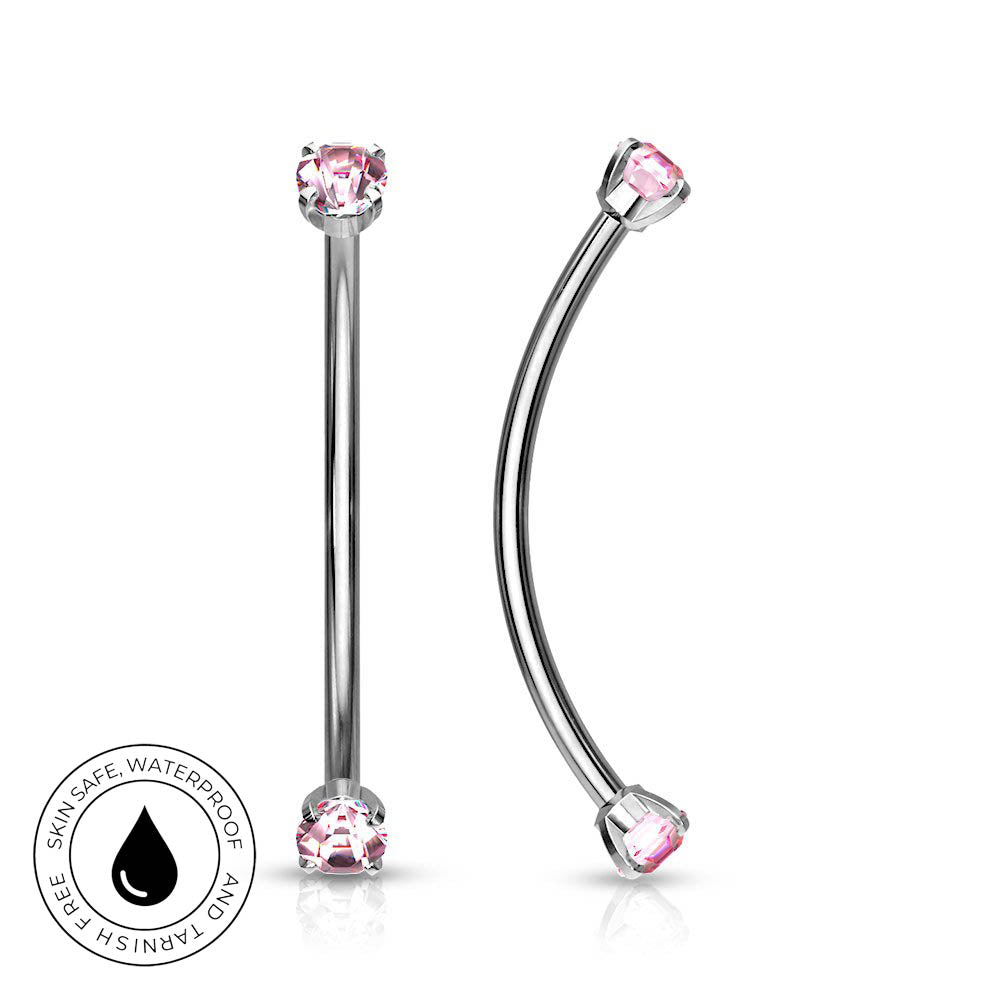 Two silver-toned body jewelry piercings with pink gemstones, shown on a white background. One is a straight barbell and the other is a curved labret.