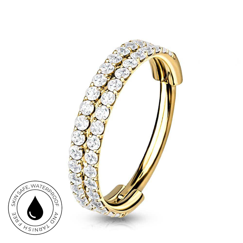 A gold-plated huggie hoop ring adorned with two rows of clear cubic zirconia stones, shown on a white background with a circular 'Skin Safe Waterproof' badge in the bottom-left corner.