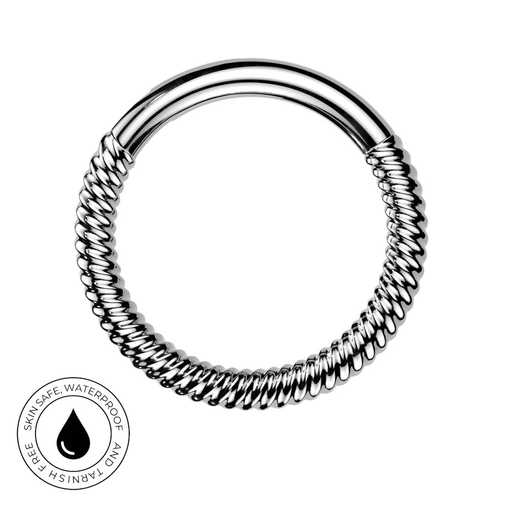 A silver-toned twisted ring with a smooth curved bar, shown on a white background with a circular 'Skin Safe Waterproof' badge in the lower-left corner.