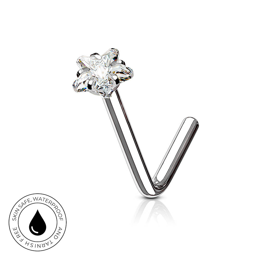 A silver-toned curved barbell nose ring with a flower-shaped clear gemstone, shown on a white background with a small circular skin-safe waterproof badge in the lower left corner.