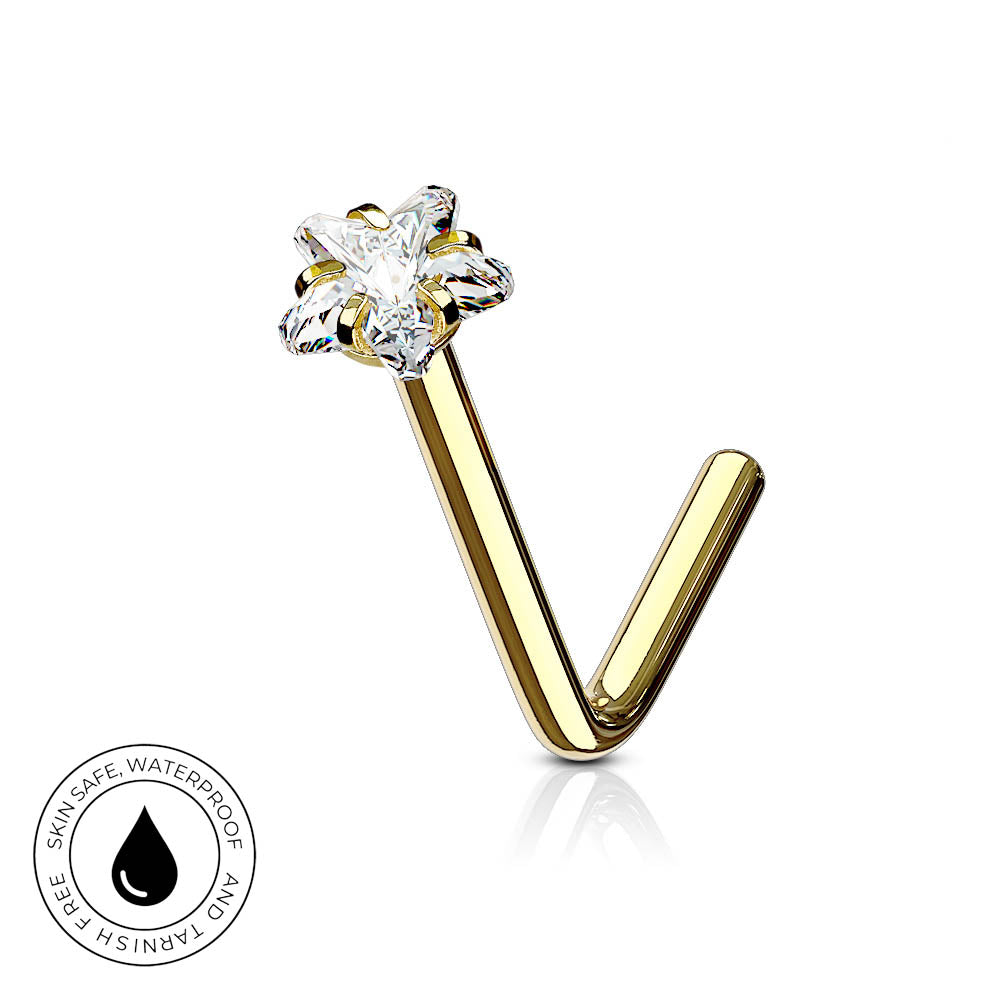 Gold curved barbell nose ring with a clear crystal flower-shaped stud, shown on a white background with a circular skin-safe waterproof badge in the lower-left corner.