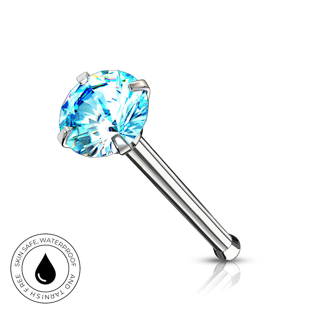 A silver-toned labret piercing stud with a round-cut light blue gemstone, shown on a white background with a small circular 'Skin Safe Waterproof' badge in the lower left corner.