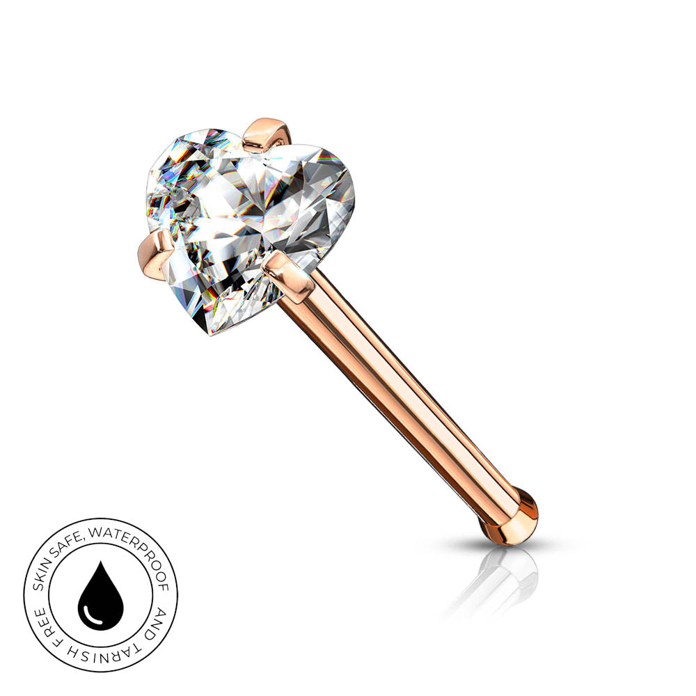 A rose gold nose ring with a heart-shaped clear gemstone, shown on a white background with a small circular 'Skin Safe Waterproof' badge in the bottom-left corner.