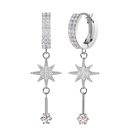 A pair of silver-toned dangle earrings adorned with clear pavé gemstones, featuring a huggie hoop, a vertical bar, a starburst motif, and a dangling round stone, set against a solid white background.