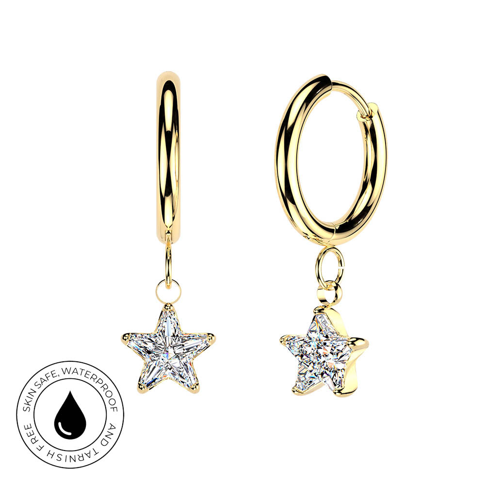 Gold huggie hoop earrings with dangling star-shaped clear gemstone charms, shown on a white background with a circular skin-safe waterproof badge in the lower left.