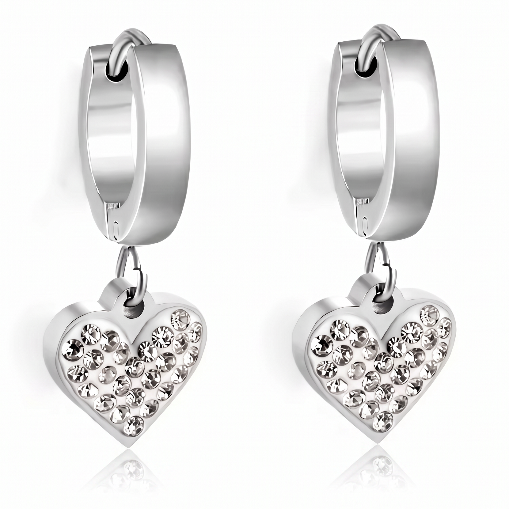 A pair of silver huggie hoop earrings with dangling heart charms encrusted with clear rhinestones, shown on a clean white background with a soft reflection.