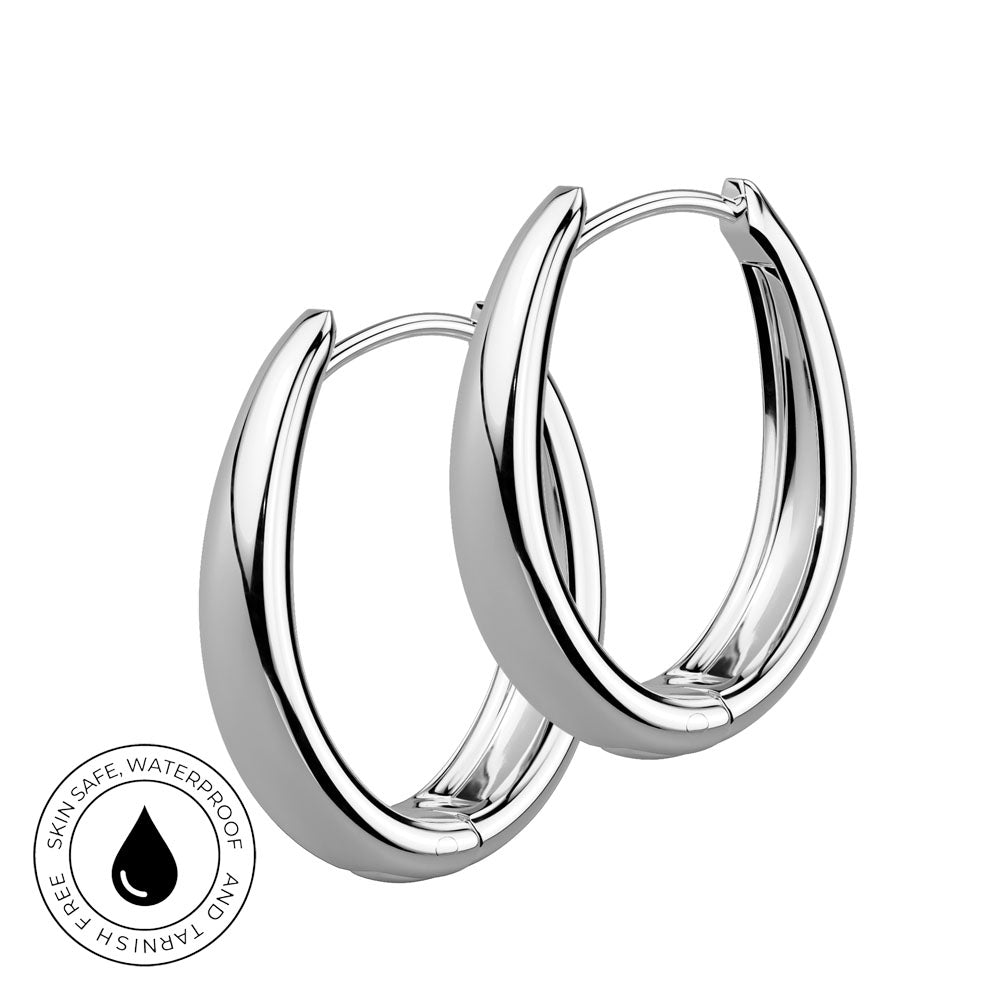 A pair of polished silver hoop earrings with a thick, modern curved design, shown on a plain white background with a circular 'Skin Safe Waterproof' certification badge in the bottom-left corner.