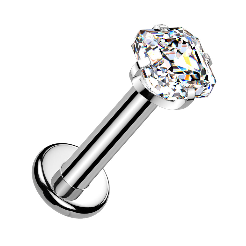 A silver-toned labret piercing stud with a large, clear, faceted cushion-cut gemstone on a plain white background.