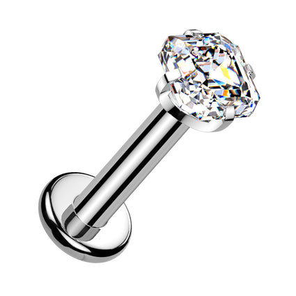 A silver-toned labret piercing stud with a large, clear, faceted cushion-cut gemstone on a plain white background.