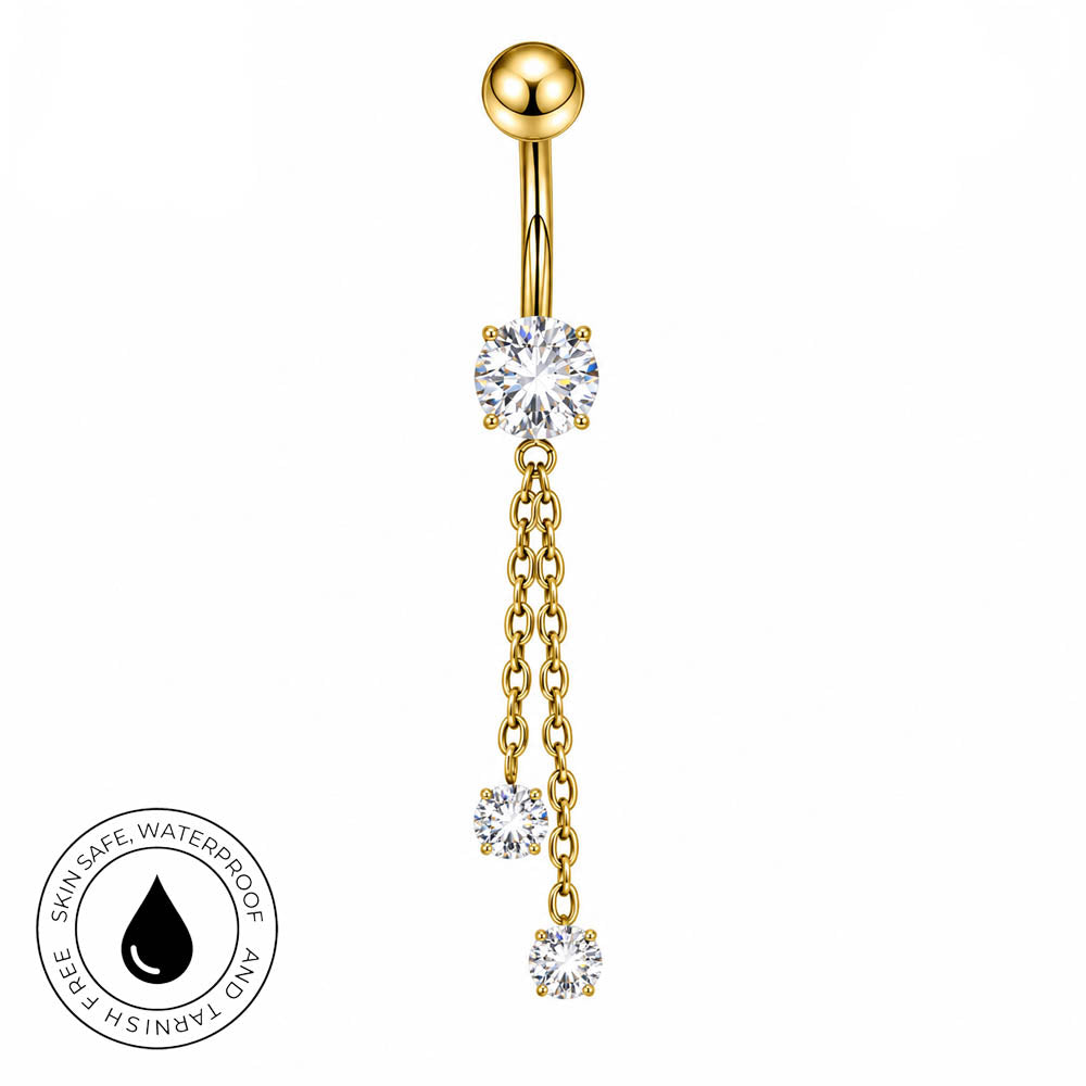 Gold-plated navel piercing barbell with a ball top, a central clear cubic zirconia stone, and three dangling chain sections ending in smaller clear stones. A circular 'Skin Safe Waterproof' badge is shown in the bottom-left corner on a plain white background.