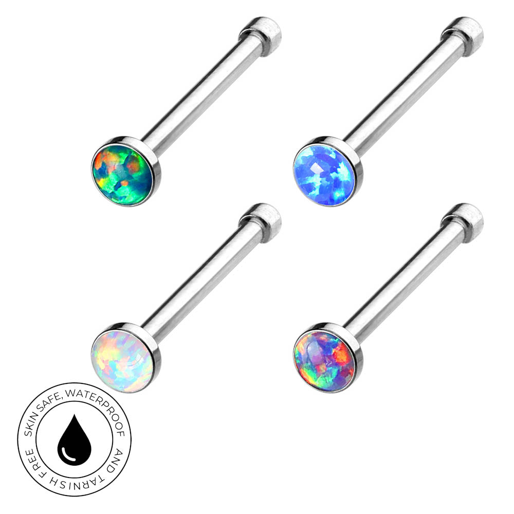 Four silver-toned labret piercing studs with round iridescent opal-like faceted tops, arranged on a white background with a circular 'Skin Safe Waterproof' badge in the lower left.