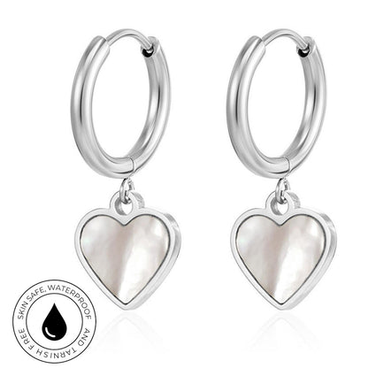 A pair of silver hoop earrings with dangling heart charms made of iridescent mother-of-pearl, shown on a white background with a circular 'Skin Safe Waterproof' certification badge in the lower-left corner.