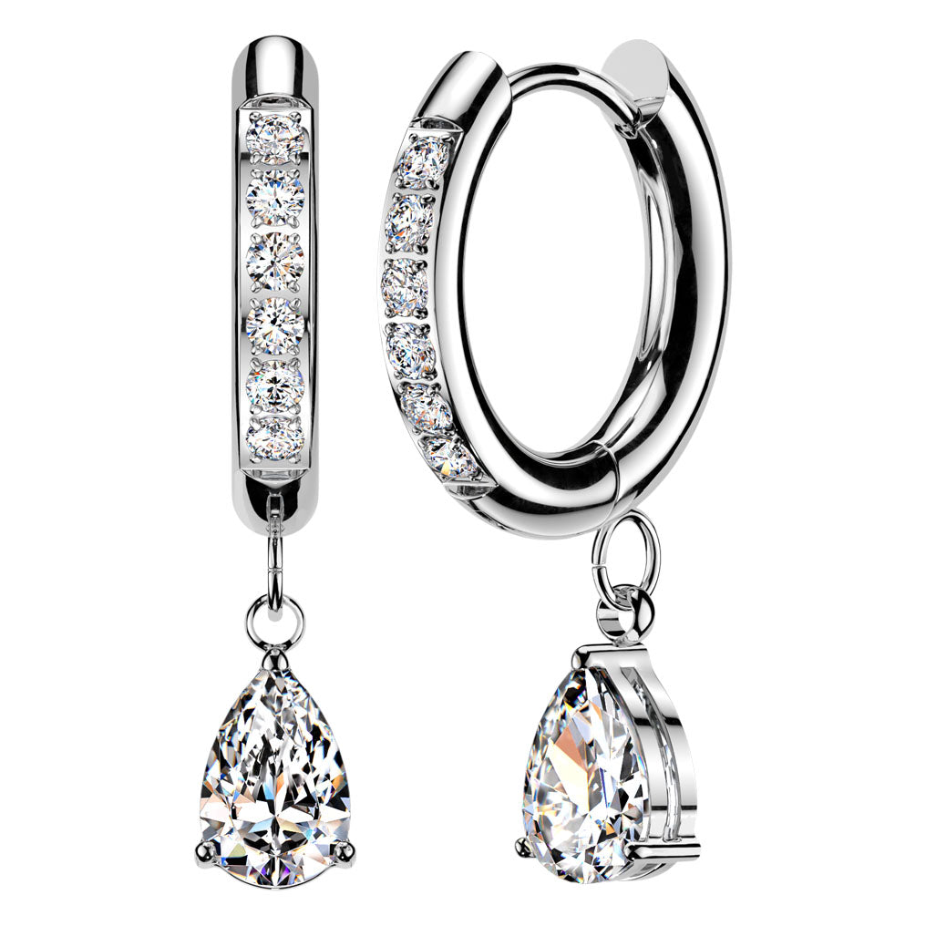 A pair of silver hoop earrings with clear gemstones, featuring a vertical bar with round stones, a curved hoop with round stones, and pear-shaped drop gemstones, shown on a white background.
