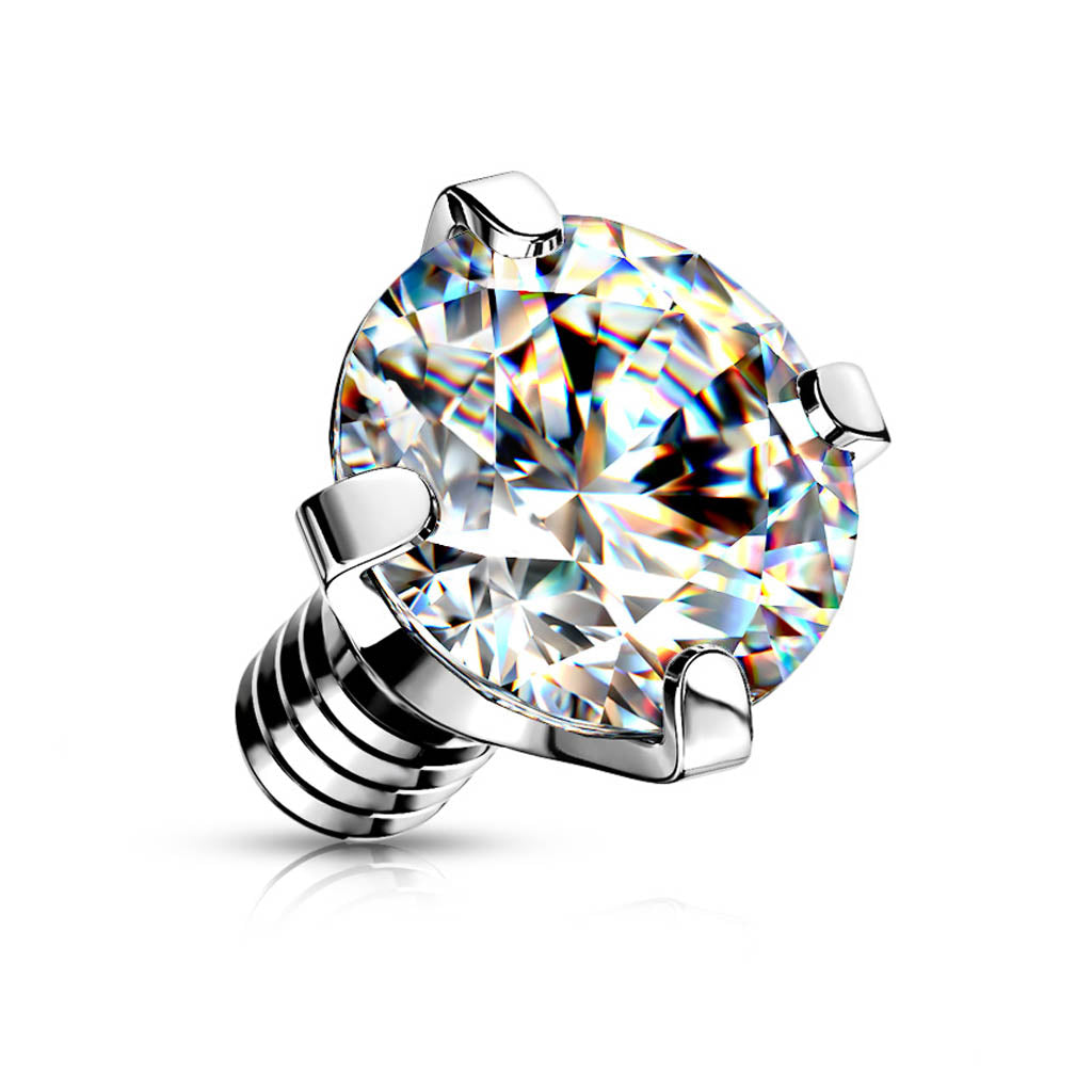 A classic solitaire diamond engagement ring with a brilliant round-cut center stone in a polished silver-toned four-prong setting, shown on a clean white background with a soft reflection.