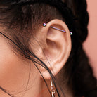 14 Gauge Gold Crystal Centre Industrial Barbell Being Worn