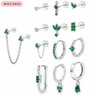A 12-piece silver stud and hoop earrings set with green gemstones, displayed on a clean white background with a pink 'MULTI PACK' label in the top left corner.