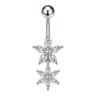 A silver-toned belly button ring featuring two dangling flower charms set with clear marquise-cut and round stones, shown against a plain white background.