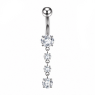 Silver-toned titanium curved barbell belly button ring with four dangling clear cubic zirconia stones, shown on a white background with a close-up inset of the hook and a black 'SOLID G23 TITANIUM' badge.