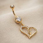 
14 Gauge Dangling Golden Looped Heart Belly Bar 
