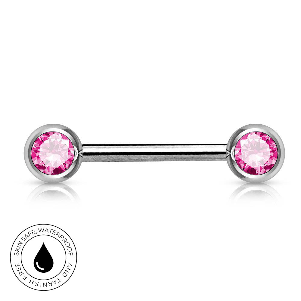 A silver-toned labret piercing barbell with two round pink gemstones, shown on a white background with a circular 'Skin Safe Waterproof' badge in the lower-left corner.