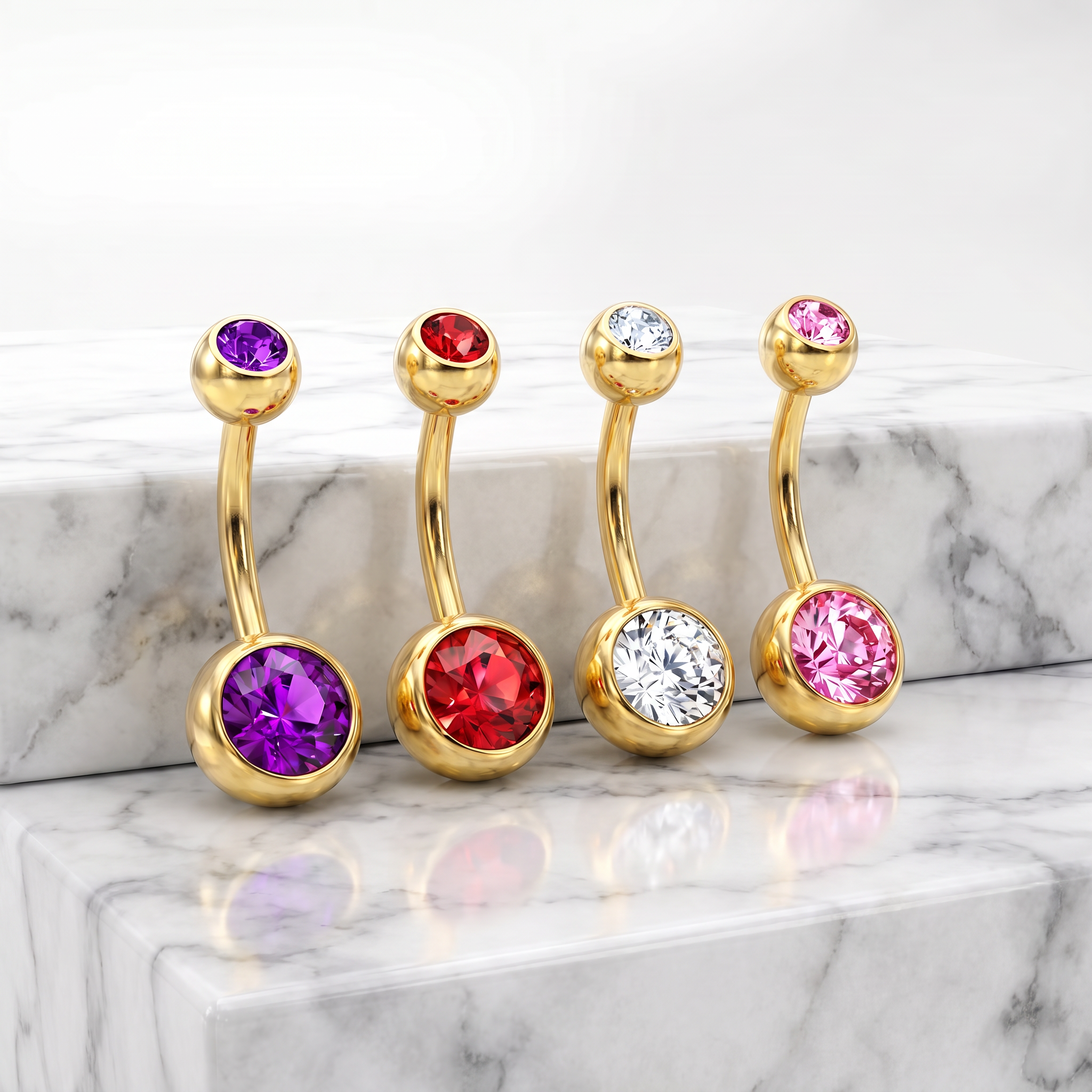Four gold curved barbell belly button piercings with round faceted gemstones in purple, red, clear, and pink, displayed on a white marble surface.