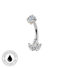 Silver curved barbell belly button ring with a round clear gemstone on top and a flower-shaped cluster of clear gemstones on the bottom, shown on a white background with a circular 'Skin Safe Waterproof' badge in the lower left.