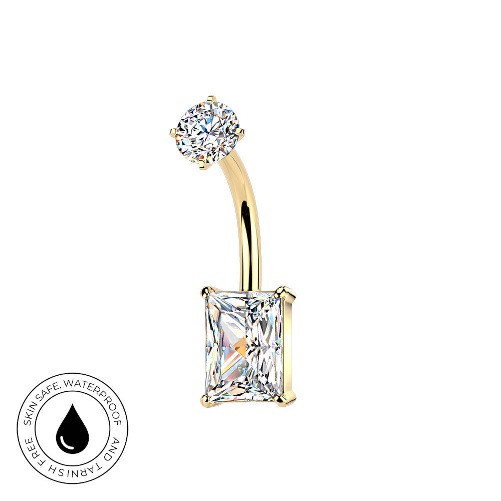 Gold curved barbell navel jewelry with a round clear gemstone on one end and a rectangular clear gemstone on the other, shown on a white background with a small circular 'skin-safe waterproof' badge in the lower left.