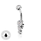 A curved barbell belly button ring with three clear round-cut gemstones, shown on a white background with a small circular 'skin-safe waterproof' badge in the lower-left corner.