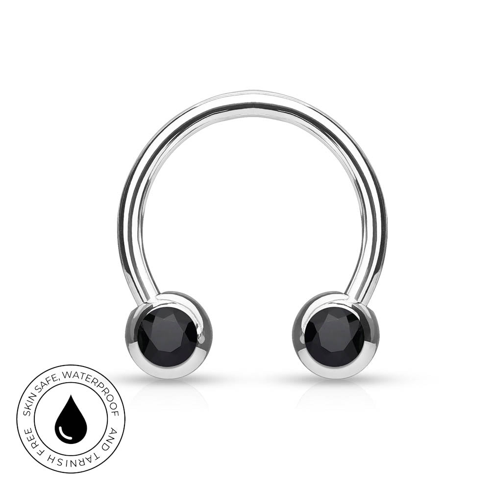 A silver-toned curved barbell piercing stud with two round black faceted gemstones, shown on a white background with a circular 'Skin Safe Waterproof' badge in the lower-left corner.