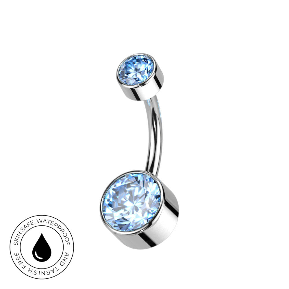 A curved barbell belly button ring with two light blue faceted gemstones in polished silver-toned settings, shown on a white background with a circular 'Skin Safe Waterproof' badge in the lower left.
