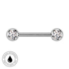 A silver-toned labret piercing barbell with two round bezel-set clear gemstones, shown on a plain white background with a circular 'Skin Safe Waterproof' badge in the lower-left corner.