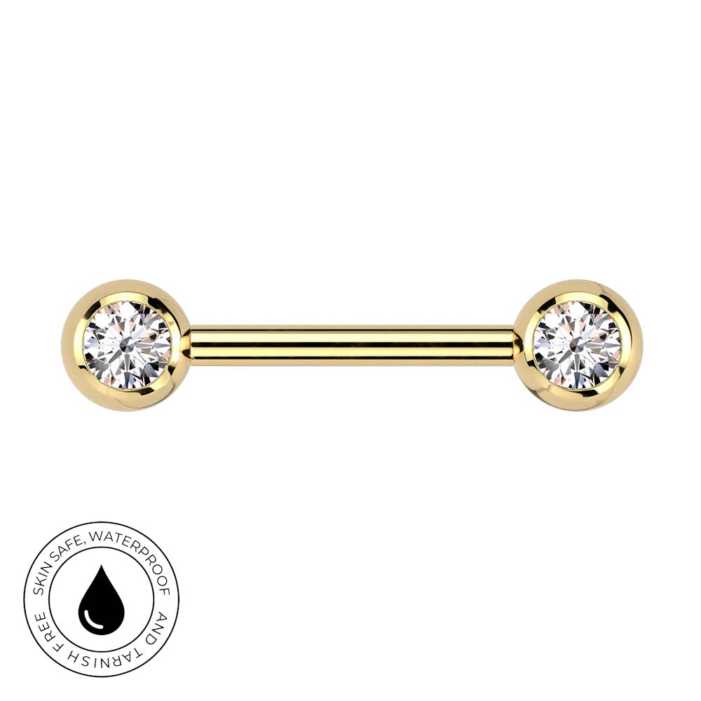 A gold-plated barbell piercing stud with two round bezel-set clear gemstones, shown on a plain white background with a circular 'Skin Safe Waterproof' badge in the bottom-left corner.