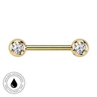 A gold-plated barbell piercing stud with two round bezel-set clear gemstones, shown on a plain white background with a circular 'Skin Safe Waterproof' badge in the bottom-left corner.