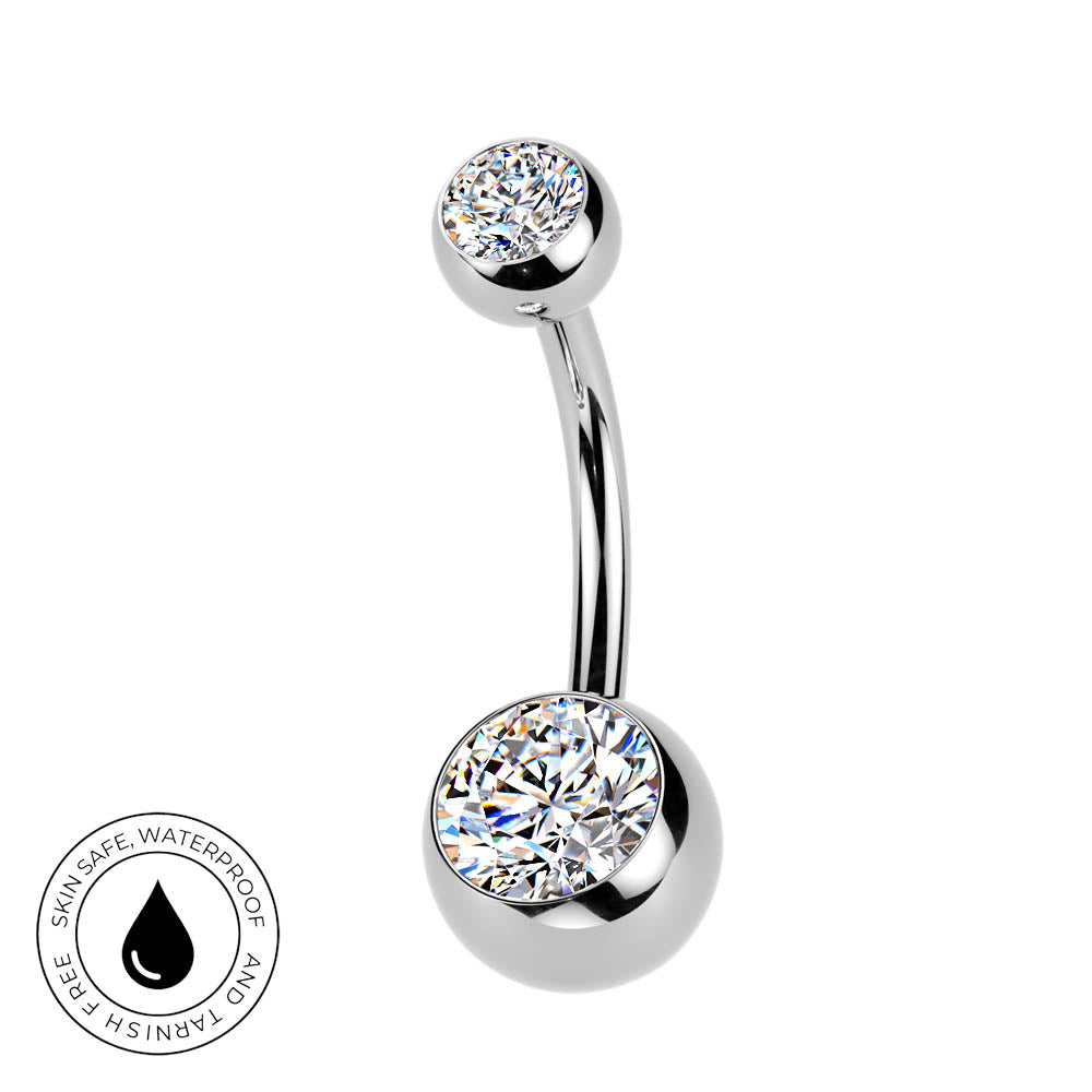 A curved barbell belly button ring with a top and bottom round bezel-set clear crystal, shown on a white background with a small circular 'skin-safe waterproof' badge in the lower left.