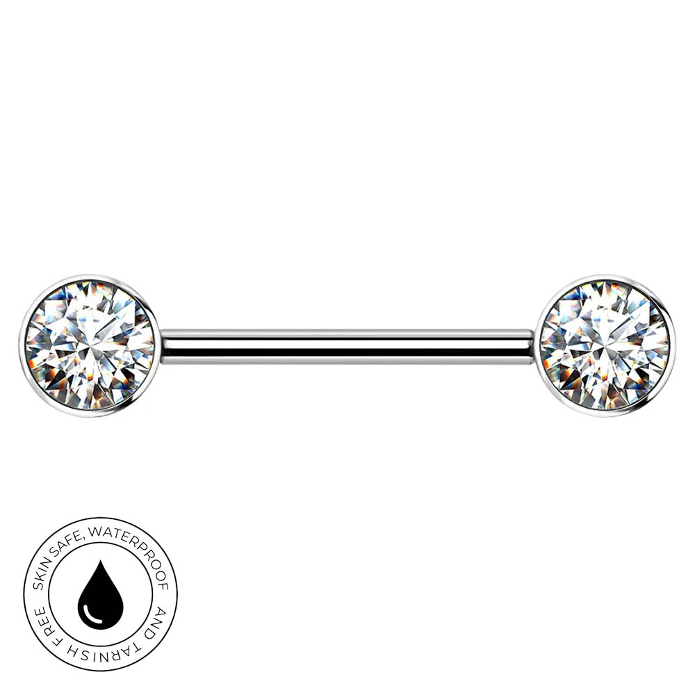 A silver-toned barbell piercing jewelry piece with two round clear gemstones, shown on a plain white background with a circular 'skin-safe waterproof' badge in the lower-left corner.