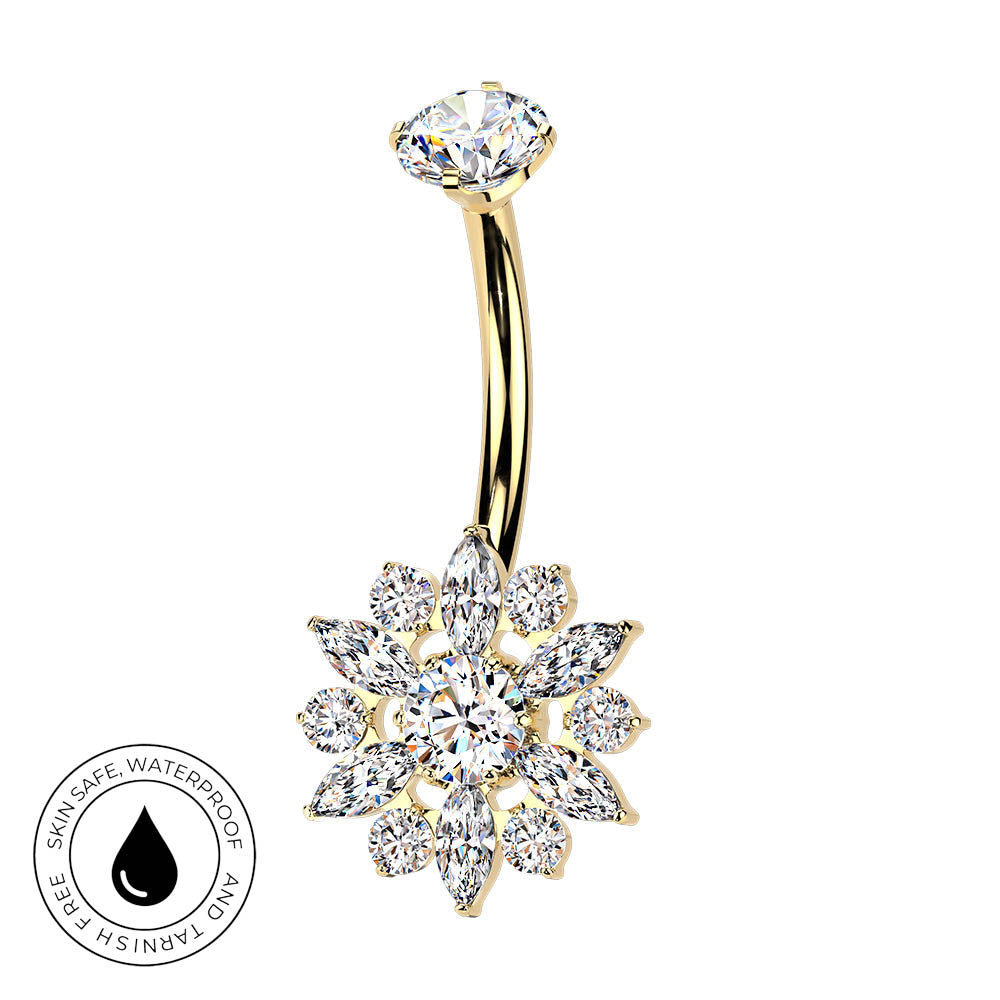 Gold curved navel barbell with a snowflake-shaped crystal cluster pendant, shown on a white background with a circular 'skin-safe waterproof' badge in the lower left.
