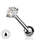 A silver-toned labret piercing barbell with a large, round-cut clear gemstone in a prong setting and a polished ball end, shown on a white background with a small circular 'SkinSafe Waterproof' badge in the lower left.